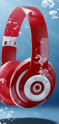 This Phone Live Wallpaper boasts a pop art design featuring red headphones floating in water