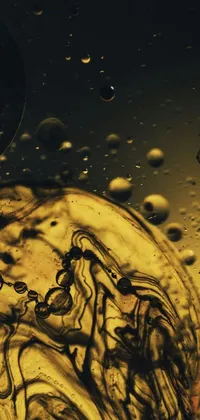 Stylize your phone with this dynamic live wallpaper featuring a glass filled with liquid resting on top of a table