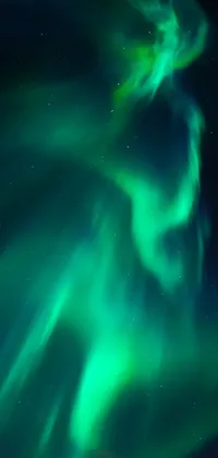 This vertical phone live wallpaper showcases the mesmerizing aurora borealis, with shimmering multicolored lights lighting up the night sky