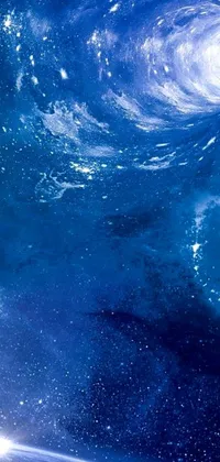 Looking for a stunning phone live wallpaper? Look no further than this space-themed image featuring a view of the earth from space! With a striking album cover, vibrant wave of water particles, and calming blue hues throughout the design, this background image is sure to impress