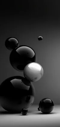 Add some abstract flair to your phone's wallpaper with this black and white image of liquid-like balls