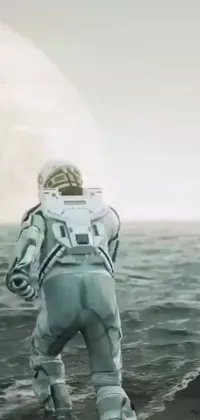 This phone live wallpaper depicts a lone astronaut traversing an endless body of water surrounded by the vastness of the ocean