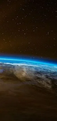 This phone wallpaper showcases a night view of Earth from space, featuring motion of plants and stars to create dynamic movement across the screen