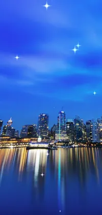 This beautiful live phone wallpaper captures the serene beauty of an urban waterfront at night