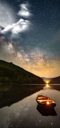 This stunning phone live wallpaper captures a peaceful lakeside scene at night