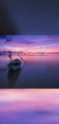 This phone live wallpaper depicts a peaceful body of water with a boat floating on the surface