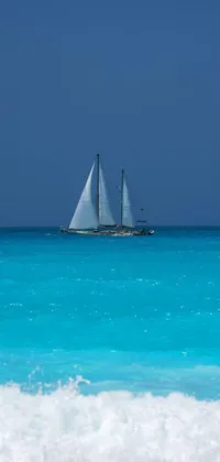 This phone live wallpaper showcases a beautiful sail boat on the ocean by Richard Carline