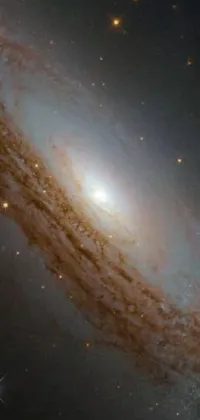 Experience the wonders of space with our phone live wallpaper featuring a breathtaking spiral galaxy with twirling arms of stars and gas