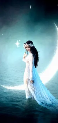 This stunning live phone wallpaper depicts a mystical scene featuring a woman in a billowing white dress standing on a crescent moon