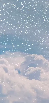 This phone live wallpaper features a serene snowy sky with clouds and snowflakes, bringing a magical and dreamlike atmosphere to your device