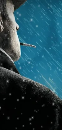 This phone live wallpaper showcases a captivating poster-style artwork of a man smoking in the snow, surrounded by heavy rainfall in the background