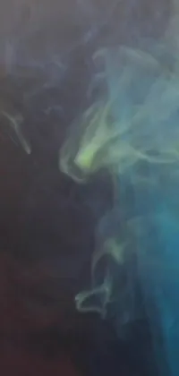 Unleash the mystique into your phone with this awe-inspiring live wallpaper! This wallpaper features a closer look at a phone billowing smoke from the cellular gaps