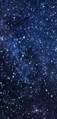 This live wallpaper features a navy blue carpet background with a variety of sparkling elements including stars, a microscopic photo, space art, glitter gif, video still, perfume bottle, and a diamond ring