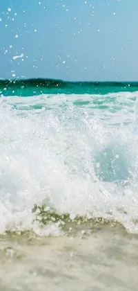 This dynamic phone live wallpaper showcases a talented surfer bravely riding the crest of a towering wave