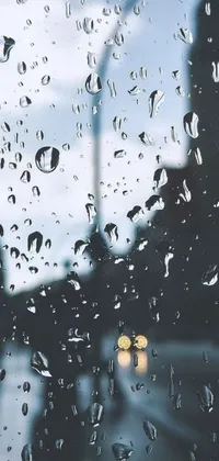Get lost in the beauty of a rainy city with this stunning live wallpaper for your phone