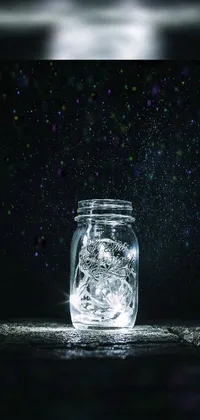 This phone live wallpaper showcases a glass jar filled with ice set against a wooden table with falling stars and fireflies flying in the background
