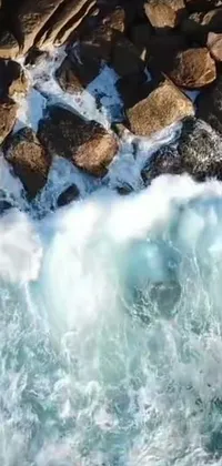 This phone live wallpaper depicts an intense surfing scene