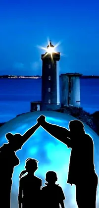 This live phone wallpaper features a stunning digital rendering of a group of people in front of a majestic light house by the sea