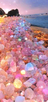This phone live wallpaper showcases a stunning beach scene filled with pink and white rocks, resembling natural gemstones