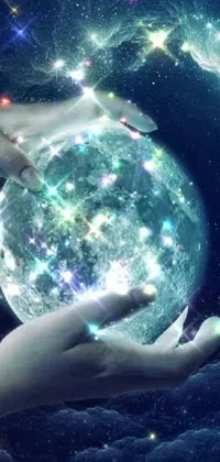 This live wallpaper features a breathtaking image of a person holding a glowing ball, set against a background of stars and a full moon