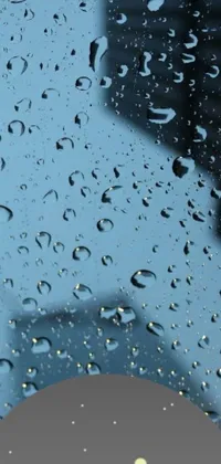 This phone live wallpaper displays a stunning city view through a rain-covered windshield