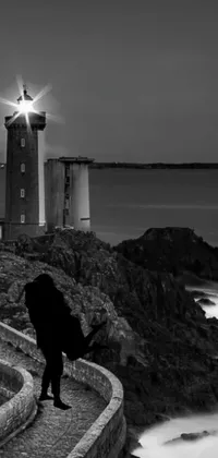 Embellish your phone's home screen with this captivating live wallpaper, featuring a breathtaking black and white photograph of a lighthouse
