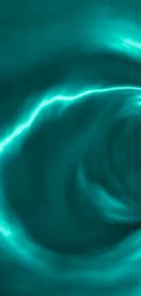 Looking for a mesmerizing phone wallpaper that adds a touch of elegance to your device? Look no further than this stunning digital artwork with a blue swirl against a black background, featuring crackling green lightning that adds intrigue and dimension to the piece