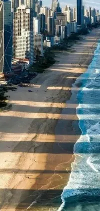 This live wallpaper showcases a hyperrealistic aerial view of a breathtaking beach with a bustling city as the backdrop