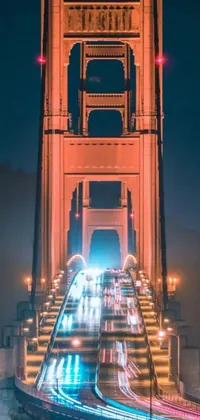 This phone live wallpaper showcases a breathtaking view of the famous Golden Gate Bridge at night