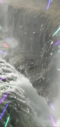 This phone live wallpaper is an amazing waterfall with colorful lights and white water