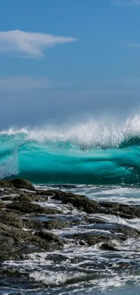 This stunning live wallpaper features an awe-inspiring ocean and rock landscape with a talented surfer braving the choppy waves