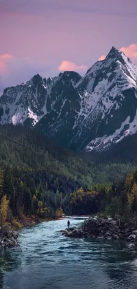 This live phone wallpaper showcases a picturesque valley with a magnificent mountain range looming over it
