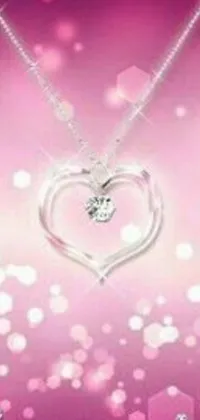 This live wallpaper for your phone showcases a breathtaking heart-shaped diamond necklace on a soft pink background