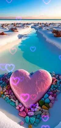 This stunning phone live wallpaper features a heart-shaped arrangement of rocks amidst a snow-covered landscape with pink and blue accents
