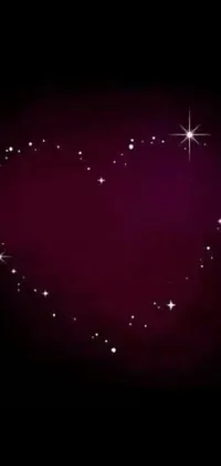 This stunning phone live wallpaper features a dark background with a heart-shaped design made of tiny stars