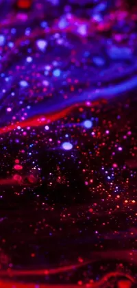 This digital art live wallpaper features a captivating close up of a cell phone on a table with a breathtaking red and purple nebula in the background