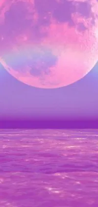 This live wallpaper for your phone features a beautiful digital rendering of a full moon over the ocean