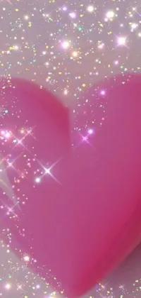 Get this charming pink heart live wallpaper for your phone! The heart sits on a table surrounded by beautiful stars