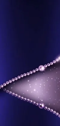 Add some glamour to your phone's background with this stunning live wallpaper featuring a close-up of a diamond necklace