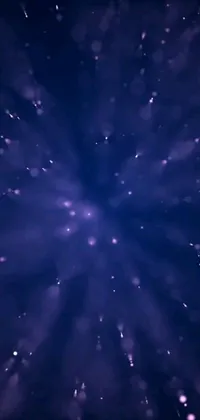 This snowflake live wallpaper depicts a mesmerizing image of snowflakes in the night sky by an anonymous digital artist