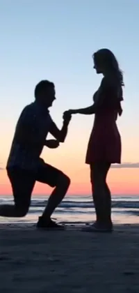 This sunset beach live wallpaper features a touching proposal scene