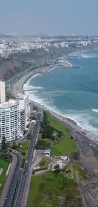 Transform your phone screen into a breathtaking aerial view of a coastal metropolis