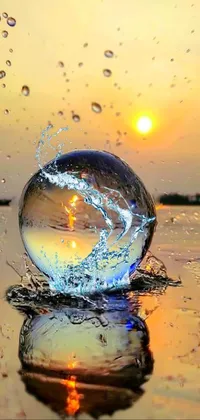 Looking for a captivating live wallpaper for your phone? Look no further than our stunning glass ball live wallpaper! This unique wallpaper features a glass ball sitting on top of a body of water during an evening rain, creating a mesmerizing backdrop for your phone