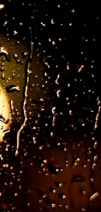 This phone live wallpaper showcases a stunningly realistic digital art of a rain-drenched window with gentle raindrops gliding down it