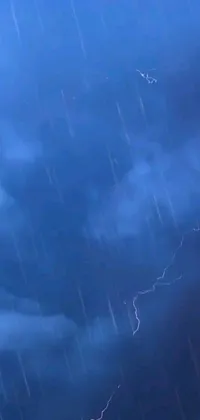 Looking for an electrifying live wallpaper for your phone? Look no further than this incredible design featuring a lightning bolt crashing through a stormy sky