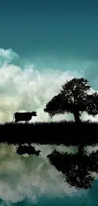 This live phone wallpaper features a surrealistic scene of a cow standing on a verdant field next to a serene lake, with a reflected night sky creating a tranquil and calming effect