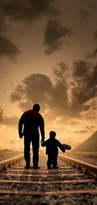 This live wallpaper features an emotive scene of a man walking with his child down a train track