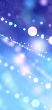 This live phone wallpaper features a mesmerizing close-up of a digital artwork with a blurry blue background and purple sparkles