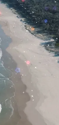 This phone live wallpaper features an aerial view of an Australian beach next to the ocean