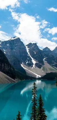 This Canada Lake Live Wallpaper showcases the breathtaking beauty of a serene blue lake, nestled amidst stunning mountains in Canada